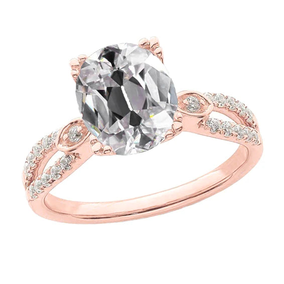 Bague Réel diamant ovale taille ancienne en or rose sertie griffes tige fendue 5.75 carats