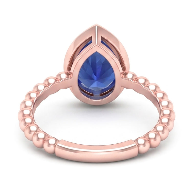 Bague Solitaire Or Rose Poire Saphir Bleu 1.50 Carats Lunette Sertie