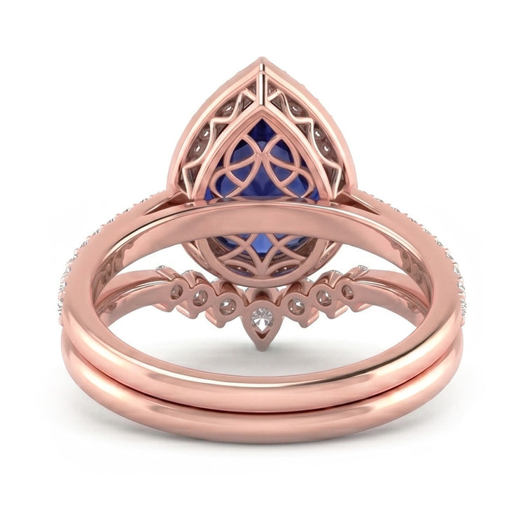 Bague de mariage Halo poire sertie saphir bleu profond et diamants 4.50 carats