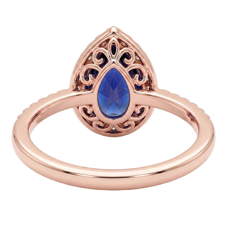 Bague en or rose avec halo et saphir bleu taille poire et diamants 3 carats