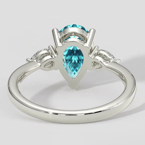 Bague en pierre latérale Paraiba en forme de poire