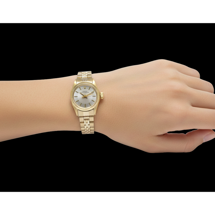 Montre Rolex Oyster Perpetual 24 mm avec cadran argenté et or jaune