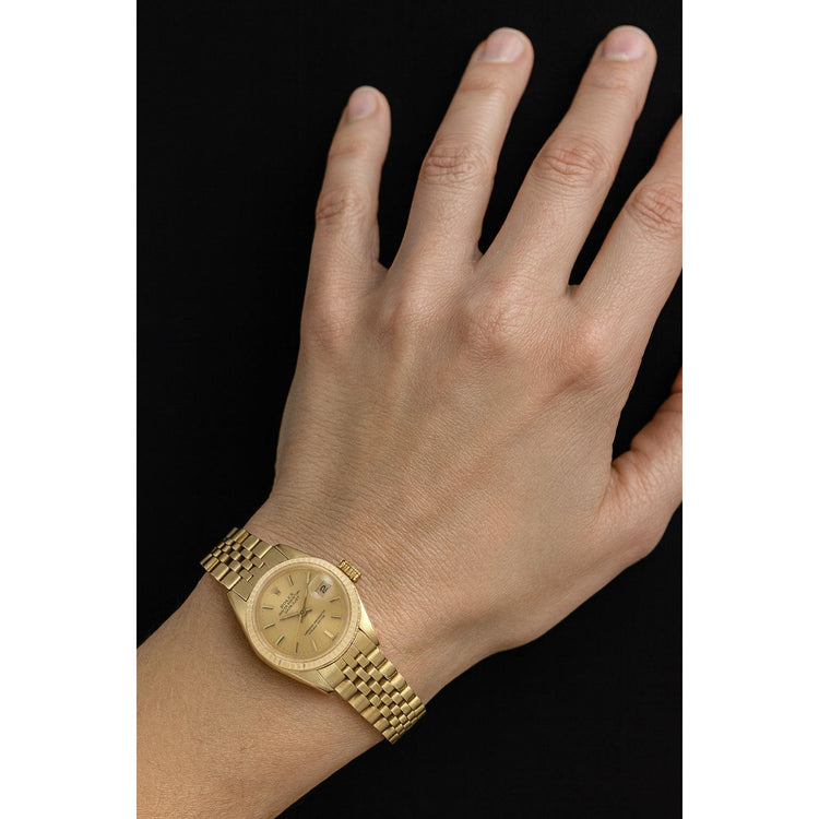 Montre Rolex Datejust 26 mm pour femme avec cadran bâton de champagne en or jaune P4