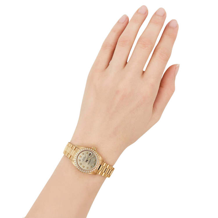 Montre Rolex President en or jaune, cadran champagne serti de diamants et lunette sertie de diamants