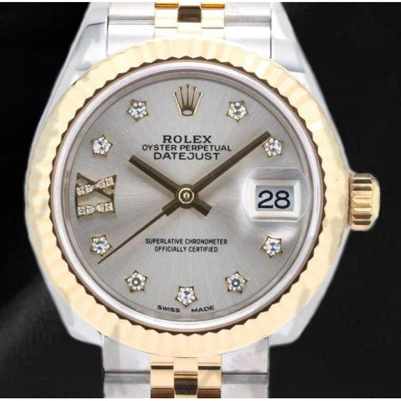 Magnifique montre pour femme Rolex avec cadran en diamant argenté et or 18 carats
