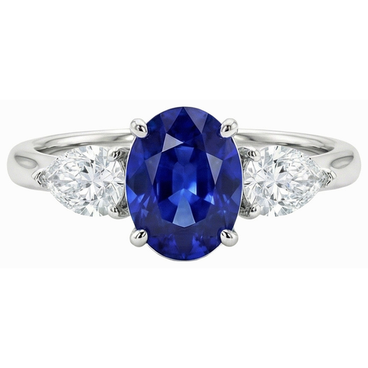 3 carats trois pierres ovales saphir bleu profond et diamants poire