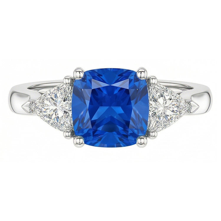 Bague 3 pierres coussin saphir bleu clair 1.50 carats trillion de diamants