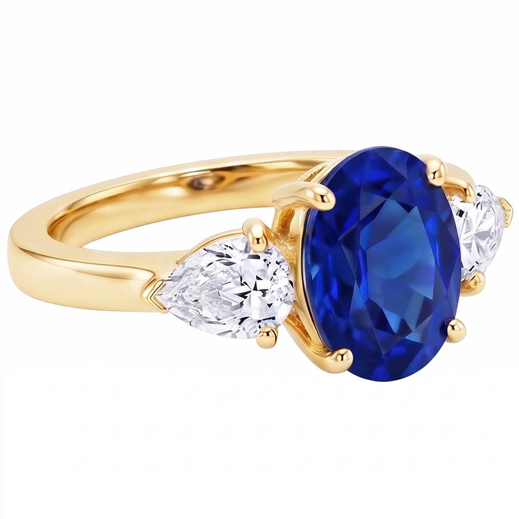 Bague 3 pierres ovale or jaune saphir bleu et diamant poire 5.25 carats
