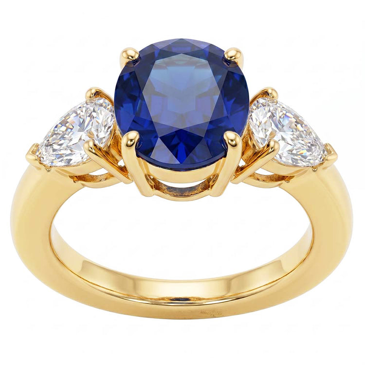 Bague 3 pierres ovale or jaune saphir bleu et diamant poire 5.25 carats
