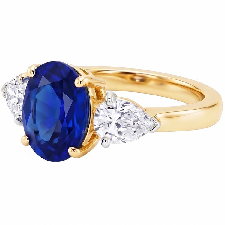 Bague 3 pierres ovale or jaune saphir bleu et diamant poire 5.25 carats