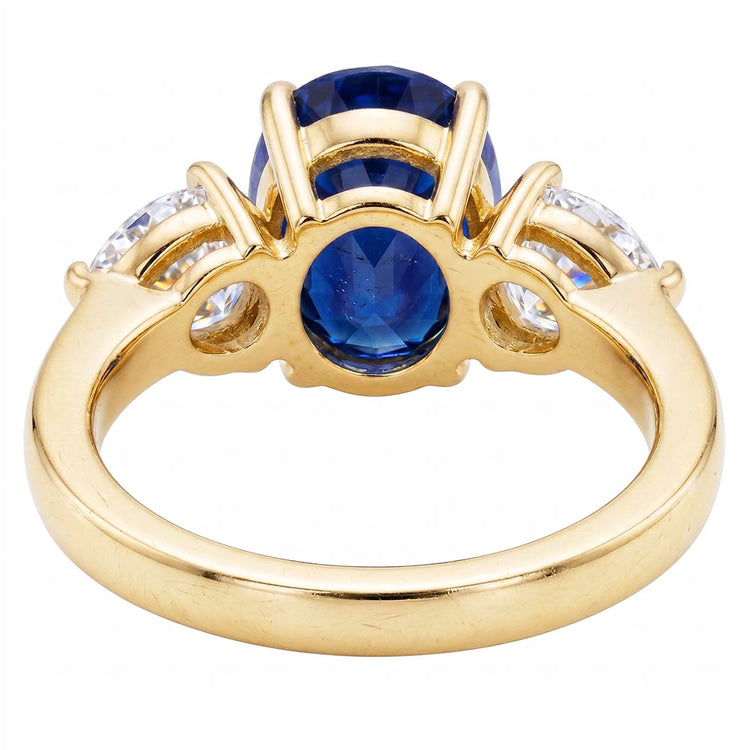 Bague 3 pierres ovale or jaune saphir bleu et diamant poire 5.25 carats