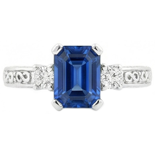 Bague 3 pierres saphir taille émeraude bleue et diamants en or 2.50 carats