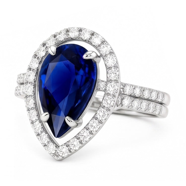 Bague de mariage Halo en or et diamants sertie au centre de saphir bleu poire 4 carats
