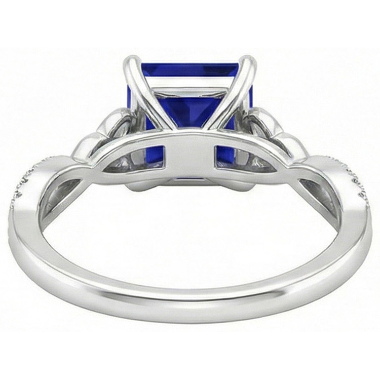 Bague diamant taille princesse saphir bleu tige torsadée en or 4 carats