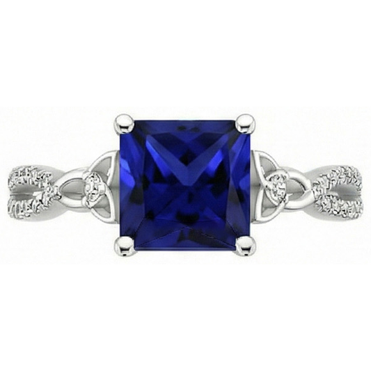 Bague diamant taille princesse saphir bleu tige torsadée en or 4 carats