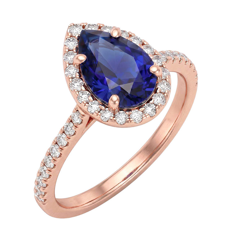Bague en or rose avec halo et saphir bleu taille poire et diamants 3 carats