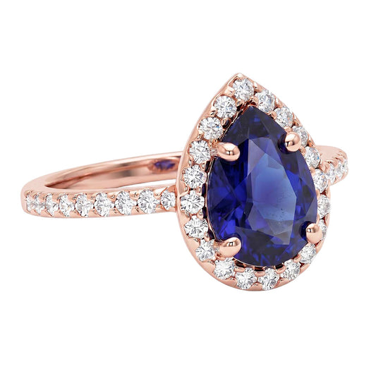 Bague en or rose avec halo et saphir bleu taille poire et diamants 3 carats
