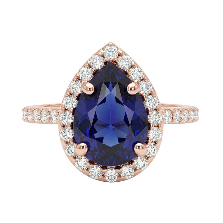 Bague en or rose avec halo et saphir bleu taille poire et diamants 3 carats