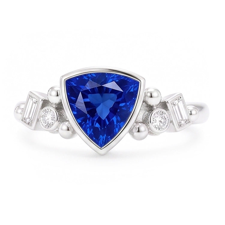 Bague en saphir bleu serti de trillions de pierres précieuses. diamants baguette 2 carats
