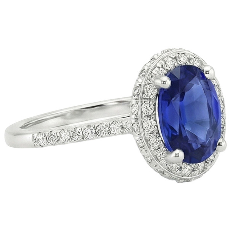 Bague saphir bleu halo taille ovale et serti de diamants 3.75 carats