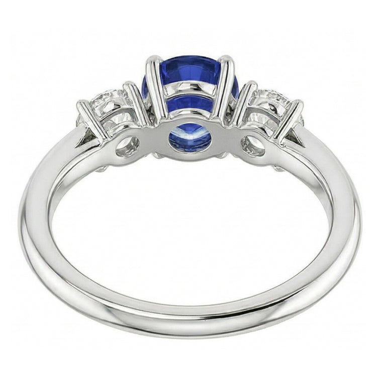 Bague trois pierres rondes en saphir bleu et diamant 1,50 carats