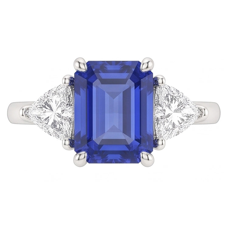Bague trois pierres saphir bleu. émeraude et trillion de diamants 2.50 carats