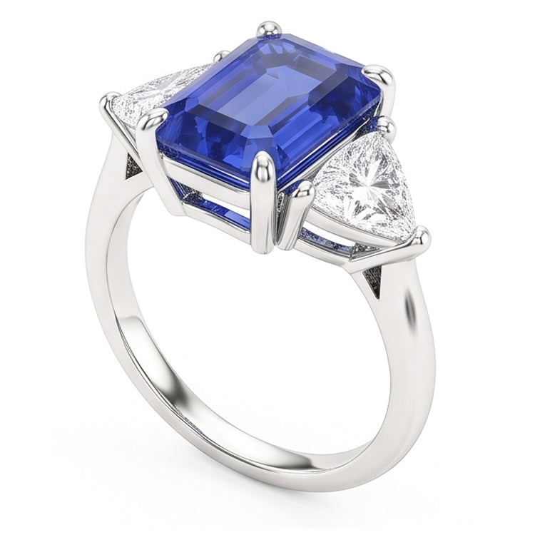 Bague trois pierres saphir bleu. émeraude et trillion de diamants 2.50 carats