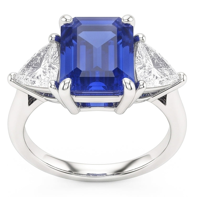 Bague trois pierres saphir bleu. émeraude et trillion de diamants 2.50 carats