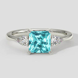 Bague de fiançailles Paraiba Coussin à trois pierres