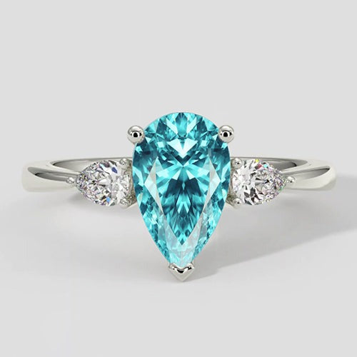 Bague en pierre latérale Paraiba en forme de poire