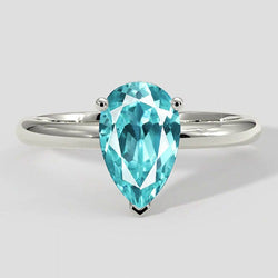 Bague solitaire en or poire Paraiba