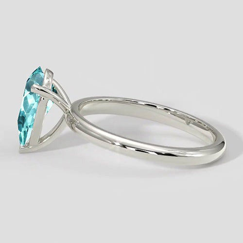 Bague solitaire en or poire Paraiba
