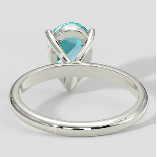 Bague solitaire en or poire Paraiba