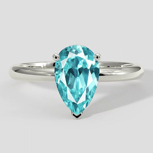 Bague solitaire en or poire Paraiba