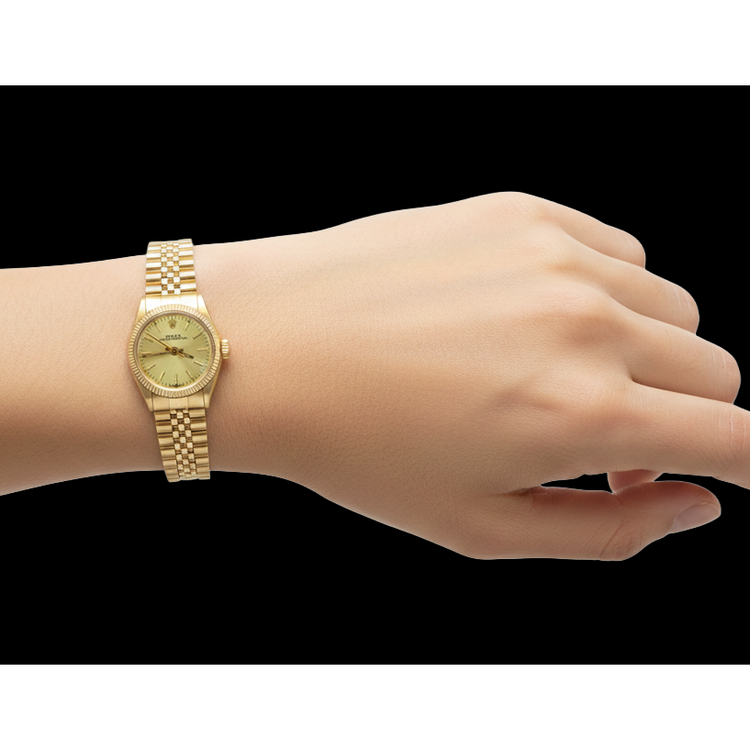 Montre Rolex 24 mm avec cadran champagne en or jaune