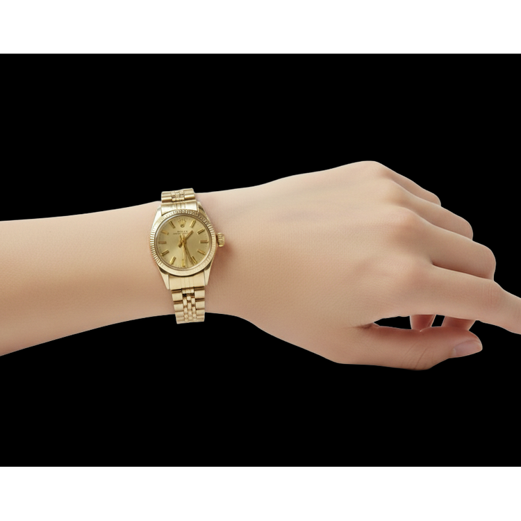 Montre Rolex Oyster Perpetual 24 mm avec cadran bâton de champagne en or jaune