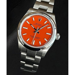 Montre Rolex Oyster Perpetual 31 en acier inoxydable lumineuse rouge