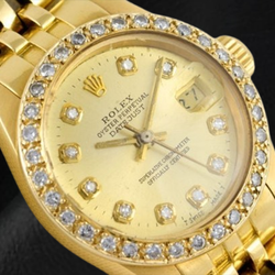 Montre Rolex Datejust 26 mm avec cadran diamant champagne President en or jaune