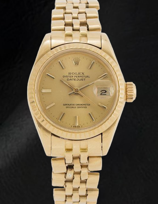 Montre Rolex Datejust 26 mm pour femme avec cadran bâton de champagne en or jaune