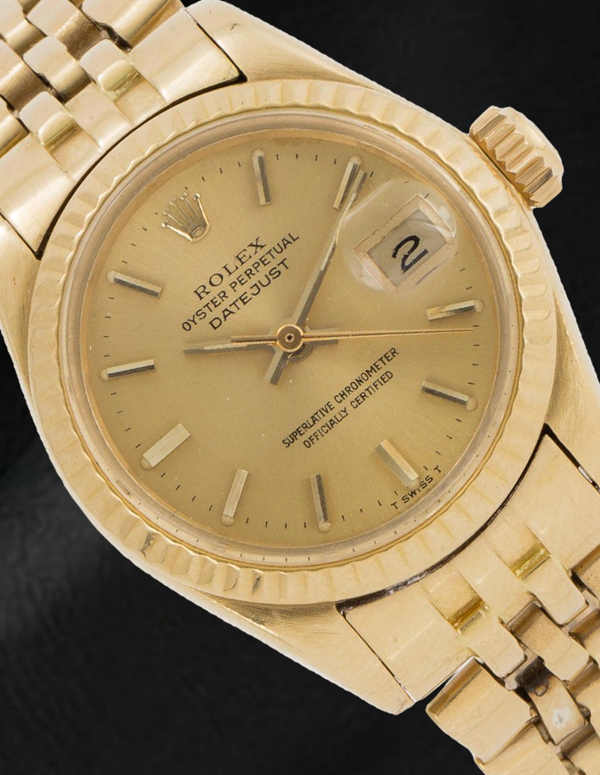 Montre Rolex Datejust 26 mm pour femme avec cadran bâton de champagne en or jaune