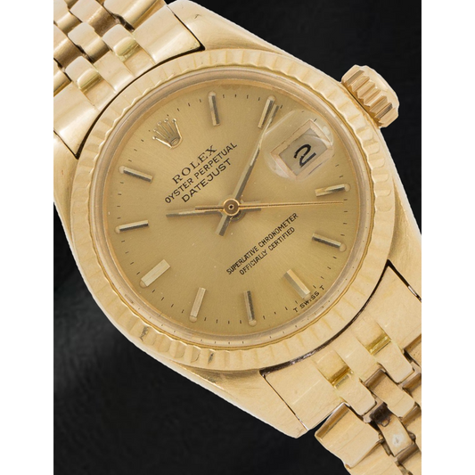 Montre Rolex Datejust 26 mm pour femme avec cadran bâton de champagne en or jaune