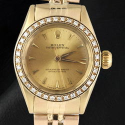 Montre Rolex Oyster Perpetual pour femme avec lunette en diamant et or jaune