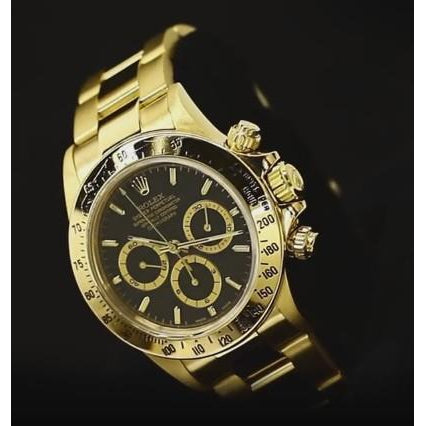 Montre Rolex à cadran noir pour homme en or jaune 18 carats
