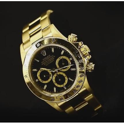 Montre Rolex à cadran noir pour homme en or jaune 18 carats