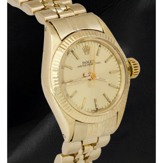 Montre Rolex 24 mm avec cadran champagne en or jaune