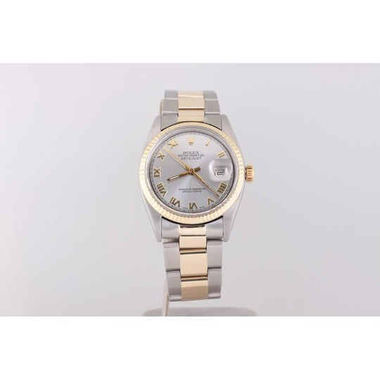Montre Rolex Datejust Lunette cannelée Bracelet huître Or Et acier inoxydable réglage rapide