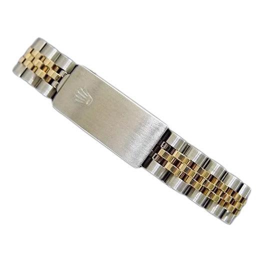 Montre Rolex dame en acier inoxydable et or avec lunette 
