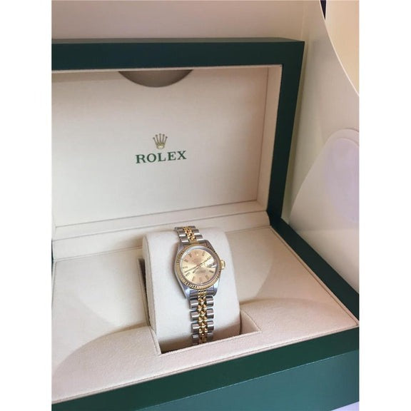 Montre Rolex Datejust pour femme, cadran bâton, lunette cannelée, bicolore