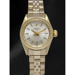 Montre Rolex Oyster Perpetual 24 mm avec cadran argenté et or jaune