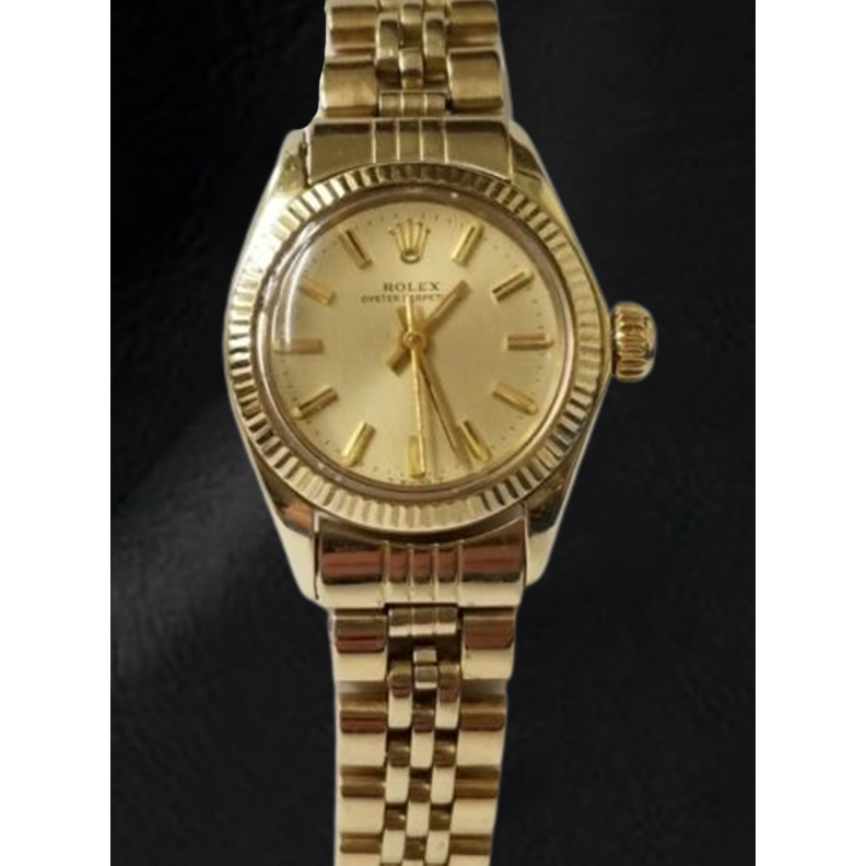 Montre Rolex Oyster Perpetual 24 mm avec cadran bâton de champagne en or jaune